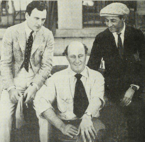 Dexter's return to work after his illness. DeMille is at center and Thomas Meighan. who replaced Dexter in Male and Female, is to the left.