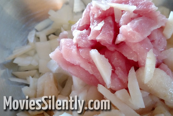 The sliced ingredients with the pork on top.