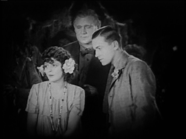 She certainly has the attention of Richard Barthelmess.