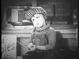 Henry wonders if he is too short for his planned bank heist.