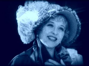 He bashes heads, she rummages for secret papers. It's perfect.