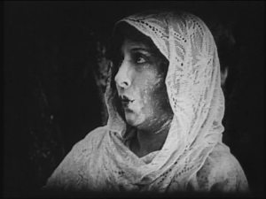 She looks like Lillian Gish if you squint hard, turn off the lights and go blind.