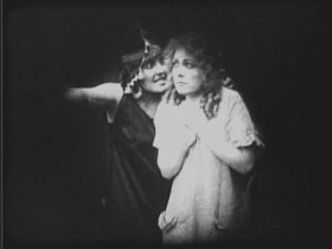 Louise Glaum wonders if she is playing this scene too subtly.