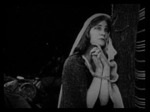 Mae Marsh’s life and honor are in peril. In other words, a normal Tuesday.