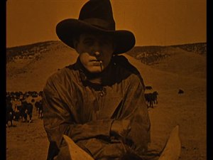 We're used to seeing Carey in a cowboy hat. (This is from "Bucking Broadway")