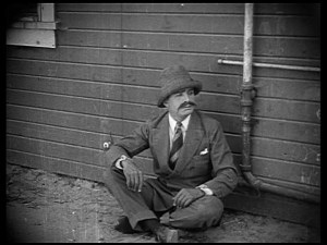 Augy tries to avoid his outsourced suicide.