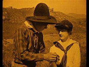 Romance in the air. Also, I want her hat.